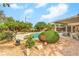 Sparkling pool surrounded by lush landscaping, creating a private and serene backyard retreat at 2810 Lava Rock Ave, North Las Vegas, NV 89031