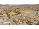 This aerial highlights the home's setting within a community near green spaces and recreational areas at 319 Belfast St, Henderson, NV 89015