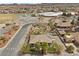 Aerial view of a well-manicured home with a private yard, paver driveway, and community amenities nearby at 319 Belfast St, Henderson, NV 89015