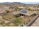 An aerial view of a residence featuring solar panels and a well-kept backyard with a covered patio at 319 Belfast St, Henderson, NV 89015