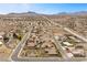 Expansive aerial view of a desert community nestled beneath picturesque mountains and clear blue skies at 319 Belfast St, Henderson, NV 89015