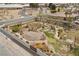 An aerial shot of an enclosed backyard with lush vegetation, stone pathways, and a private garden area at 319 Belfast St, Henderson, NV 89015