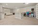 Large finished basement area with built-in shelving, a sofa, and a desk at 319 Belfast St, Henderson, NV 89015