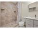 Bathroom with tile shower featuring a tiled bench and a rainfall shower head at 319 Belfast St, Henderson, NV 89015