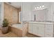 Bathroom with soaking tub, and double sink vanity at 319 Belfast St, Henderson, NV 89015
