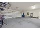 Spacious garage with multiple car doors, storage, and a painted floor at 319 Belfast St, Henderson, NV 89015