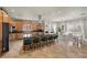 Kitchen boasting stainless steel appliances, an eat-in island, wooden cabinets and a nearby dining area at 319 Belfast St, Henderson, NV 89015