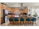 Spacious kitchen with ample counter space, wooden cabinetry, and an eat-in island at 319 Belfast St, Henderson, NV 89015