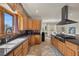 Charming kitchen with stone countertops, stainless steel appliances, and wooden cabinetry at 319 Belfast St, Henderson, NV 89015