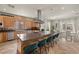 Bright kitchen with large island with gas cooktop, lots of cabinets and stainless steel appliances at 319 Belfast St, Henderson, NV 89015