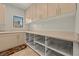 Bright laundry room with cabinets, countertop space, and rolling storage bins at 319 Belfast St, Henderson, NV 89015