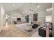 Bright living room with high ceilings, built-in shelving, tile floors, and a neutral color palette at 319 Belfast St, Henderson, NV 89015