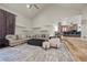 Cozy living area featuring vaulted ceilings, and views of kitchen, seamlessly blending style and functionality at 319 Belfast St, Henderson, NV 89015