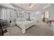 Spacious main bedroom suite featuring a tray ceiling and a ceiling fan at 319 Belfast St, Henderson, NV 89015