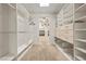 Spacious walk-in closet with custom shelving, drawers, and ample storage space throughout at 319 Belfast St, Henderson, NV 89015
