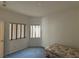 Bedroom featuring two windows with blinds and carpeted floors at 3213 Partridge Run St, Laughlin, NV 89029