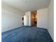 Spacious carpeted bedroom leads to ensuite bathroom at 3213 Partridge Run St, Laughlin, NV 89029