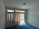 Neutral bedroom features large windows and sliding glass doors to backyard at 3213 Partridge Run St, Laughlin, NV 89029