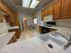 Kitchen featuring oak cabinets, white countertops and appliances and breakfast nook at 3213 Partridge Run St, Laughlin, NV 89029