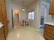 Kitchen nook with a dining table and a laundry room view, next to the exit at 3213 Partridge Run St, Laughlin, NV 89029