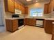 Kitchen featuring oak cabinets and white countertops and appliances at 3213 Partridge Run St, Laughlin, NV 89029