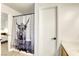 Charming bathroom with a decorative shower curtain, next to the ensuite bedroom at 3650 Mcmurty Ct, Las Vegas, NV 89129
