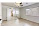 Bright bedroom features a ceiling fan, mirrored closet doors and wood-look laminate flooring at 3650 Mcmurty Ct, Las Vegas, NV 89129