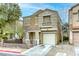 Charming two-story home featuring a well-manicured lawn, desert landscaping and a single-car garage at 3650 Mcmurty Ct, Las Vegas, NV 89129