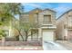 Charming two-story home featuring a well-manicured lawn, desert landscaping and a single-car garage at 3650 Mcmurty Ct, Las Vegas, NV 89129