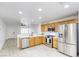 Well-lit kitchen featuring stainless steel appliances, light wood cabinets, and a spacious layout at 3650 Mcmurty Ct, Las Vegas, NV 89129