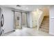 Inviting living room with sliding glass doors and hardwood floors leading to the staircase at 3650 Mcmurty Ct, Las Vegas, NV 89129