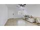 Bright living room with a modern sofa, desk, and lots of natural light at 3650 Mcmurty Ct, Las Vegas, NV 89129