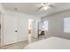 Bright main bedroom with a view of the ensuite bathroom and hardwood floors at 3650 Mcmurty Ct, Las Vegas, NV 89129