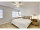 Light and airy main bedroom with hardwood floors, ceiling fan, and dual nightstands at 3650 Mcmurty Ct, Las Vegas, NV 89129