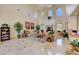 Spacious lobby featuring travertine flooring, a fireplace, and a reception desk at 3734 John Bailey St, Las Vegas, NV 89129