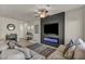 Relaxing living room with fireplace, comfortable seating, and view of the entry at 3760 Seyfert Ave, North Las Vegas, NV 89084