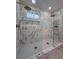 Modern bathroom with dual rainfall shower heads and sleek glass enclosure at 4054 Venita Ct, Las Vegas, NV 89120