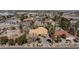 High angle view of the property, highlighting the surrounding neighborhood, landscaping and driveway at 4300 Del Monte Ave, Las Vegas, NV 89102
