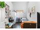 A small bedroom boasts a window with shutters and unique decor at 4300 Del Monte Ave, Las Vegas, NV 89102
