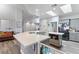 Bright kitchen features a large island with white countertop and gray cabinets at 4300 Del Monte Ave, Las Vegas, NV 89102