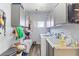 Functional laundry room featuring a washing machine, sink, ample storage and counter space at 4300 Del Monte Ave, Las Vegas, NV 89102