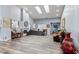 Spacious room featuring high ceilings with skylights, modern flooring, and ample natural light at 4300 Del Monte Ave, Las Vegas, NV 89102