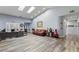 Bright and airy room featuring modern flooring, skylights, and neutral wall color at 4300 Del Monte Ave, Las Vegas, NV 89102