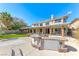 Outdoor kitchen, manicured lawn, mature trees, and a patio, perfect for outdoor dining and entertaining at 4481 Grey Spencer Dr, Las Vegas, NV 89141