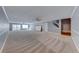 Expansive basement with neutral carpet, recessed lighting, ceiling fan, and access to the upper levels via stairs at 4481 Grey Spencer Dr, Las Vegas, NV 89141