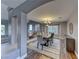 Open dining room featuring a modern table set and decorative lighting, with wood and carpet flooring at 4481 Grey Spencer Dr, Las Vegas, NV 89141