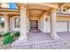 Grand entryway showcasing a double door entrance framed by stately columns and a brick walkway at 4481 Grey Spencer Dr, Las Vegas, NV 89141