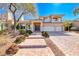 Stunning two-story home features a three-car garage, beautiful landscaping, and inviting curb appeal at 4481 Grey Spencer Dr, Las Vegas, NV 89141