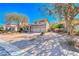 Charming two-story home featuring a three-car garage and meticulously maintained desert landscaping at 4481 Grey Spencer Dr, Las Vegas, NV 89141