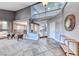 Elegant foyer with high ceilings, tiled floors, and a view of the upper-level balcony at 4481 Grey Spencer Dr, Las Vegas, NV 89141
